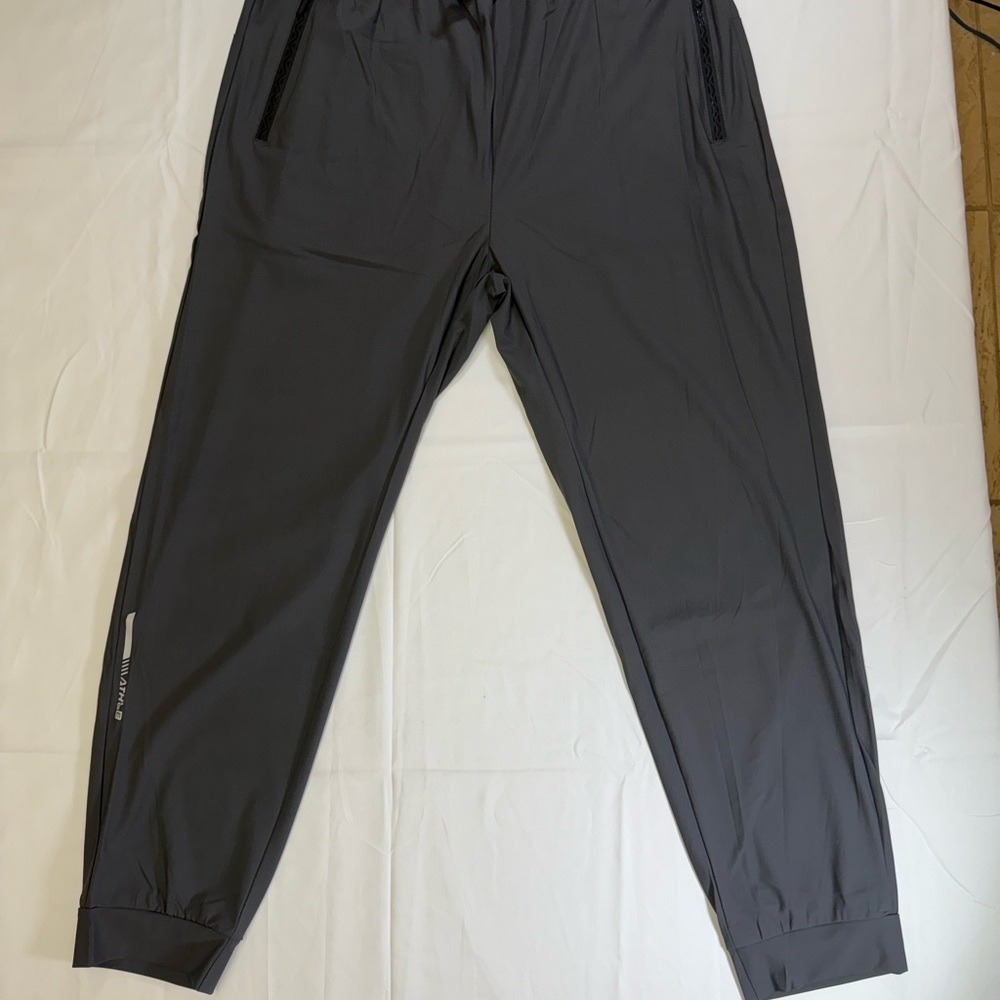 Dark Gray‎ Dri-Fit Jogger Pants - Size M Drawstring Waist, zipper pockets.